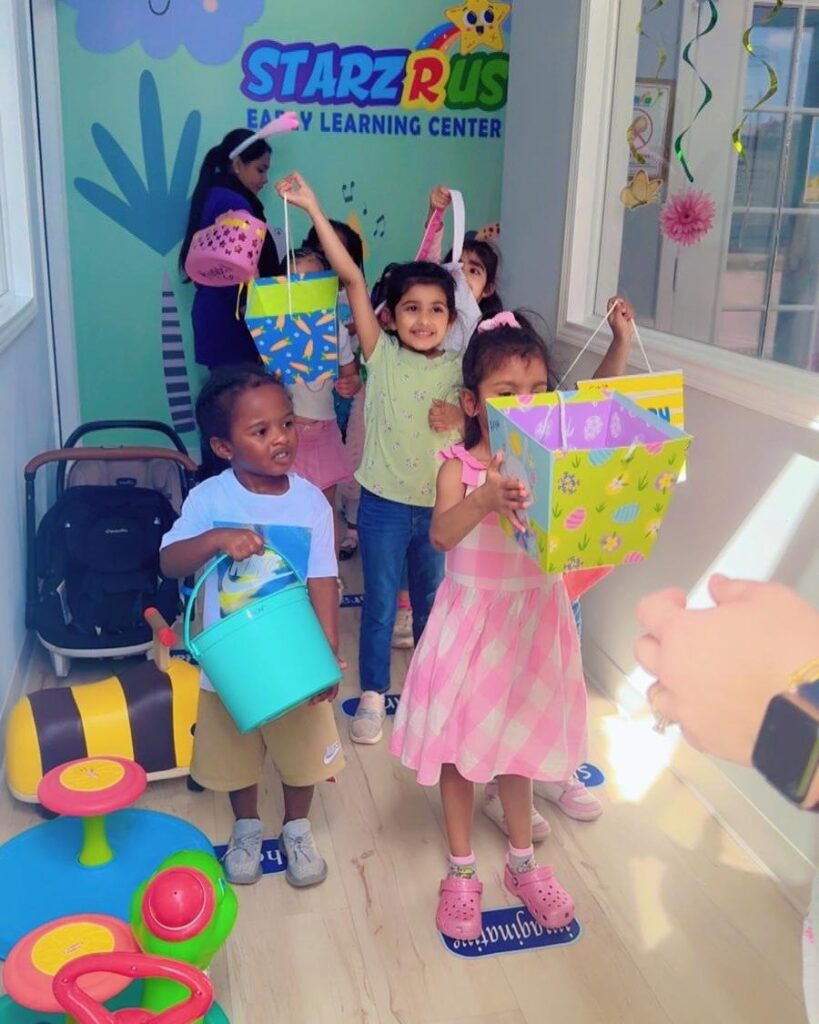 Children showing colorful arts and crafts projects