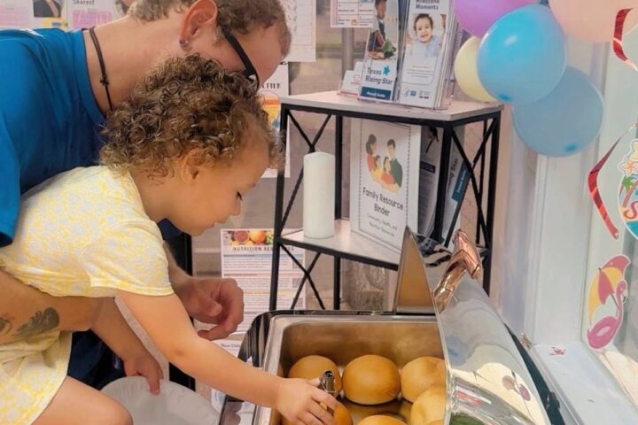 Child taking part in a supervised baking activity
