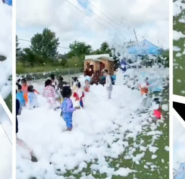 Children participating in a supervised outdoor foam activity