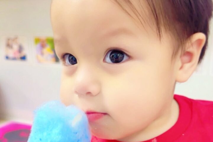 Infant participating in an age-appropriate sensory activity