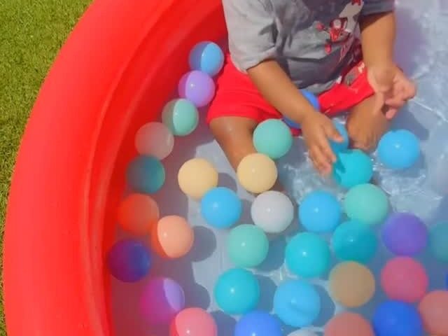 Toddler enjoying a supervised colorful play activity